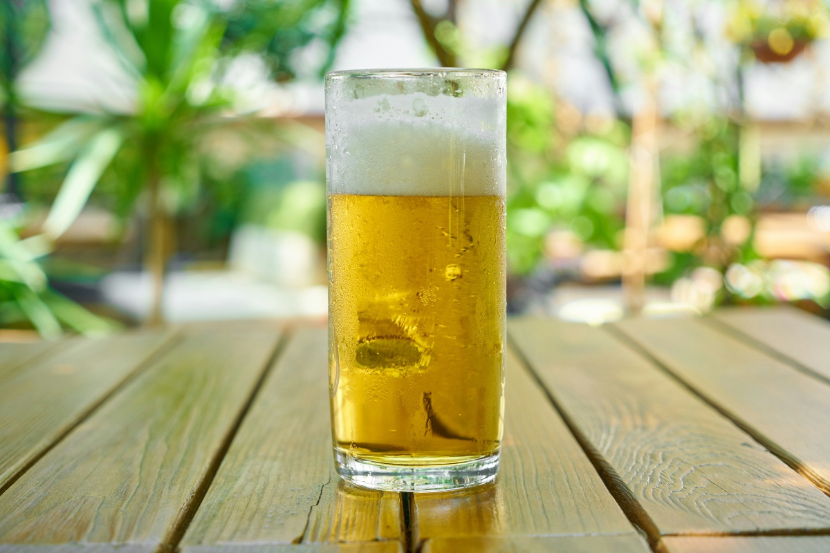 An image showing a fresh glass of draft beer poured at home