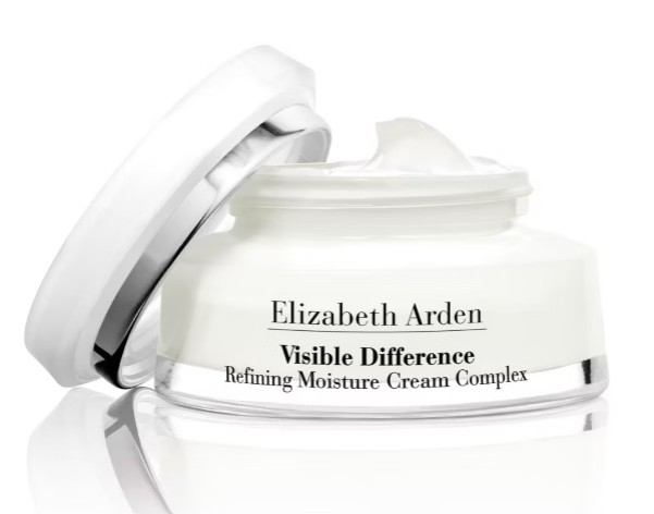 A jar of Elizabeth Arden Visible Difference Refining Moisture Cream Complex with its lid partially open, showing the white cream inside.