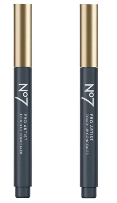Two No7 Pro Artist Touch Up Concealer pens with gold caps and dark blue bodies are standing upright side by side.
