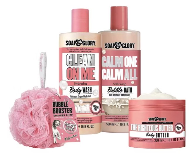 Soap & Glory bath set featuring a pink shower puff, Clean On Me body wash, Calm One Calm All bubble bath, and The Righteous Butter body butter.