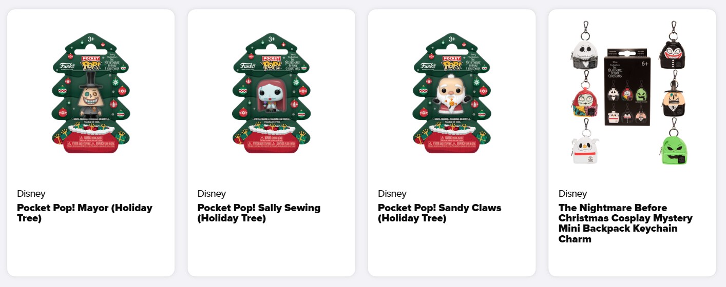 Four Disney collectable items from The Nightmare Before Christmas, including three Holiday Tree Pocket Pops and one set of mini rucksack keyring charms, are displayed in retail packaging.