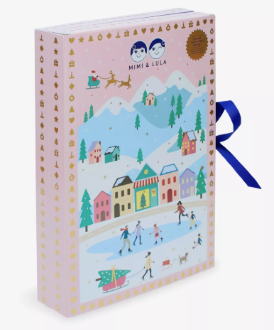 Rectangular box with winter village illustration, ice skaters, and gold icons on the edges. Blue ribbon on the side; “Mimi & Lula” logo at the top.