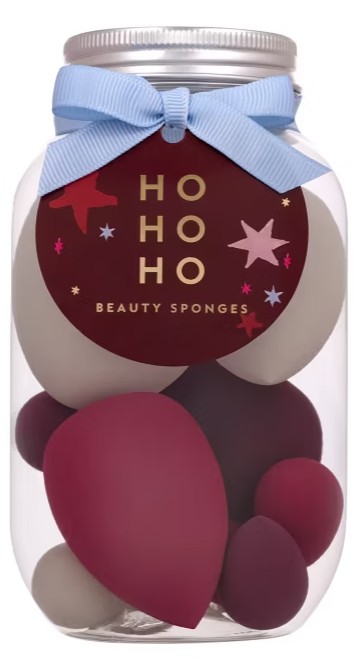 beauty sponges A clear jar filled with red and white beauty sponges, topped with a blue ribbon and a round “HO HO HO Beauty Sponges” tag.
