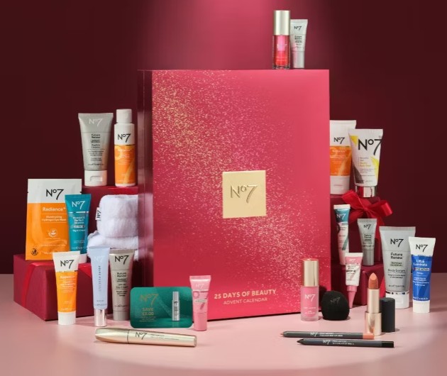 no7 advent calendar No7 25 Days of Beauty Advent Calendar displayed with various No7 skincare and make-up products arranged around a large red and gold box on a red background.