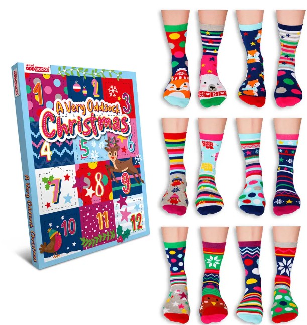 odd socks A box labelled “A Very Oddsock Christmas” beside twelve pairs of colourful, mismatched socks on feet, arranged in a grid.
