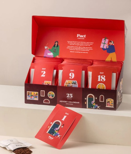 pact coffee 2026 A red box labelled “Pact Coffee” displays a 25-day advent calendar with individually numbered coffee packets arranged inside.