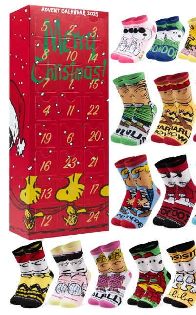 peanuts 2 Red Peanuts-themed 2023 advent calendar box with 12 pairs of colourful socks featuring Snoopy, Charlie Brown, and other Peanuts characters arranged next to it.