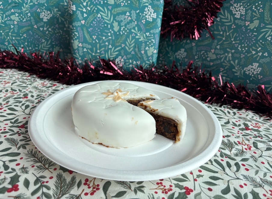 asda christmas cake 2026 An image showing an Asda Christmas cake for 2026 with a slice taken out of it