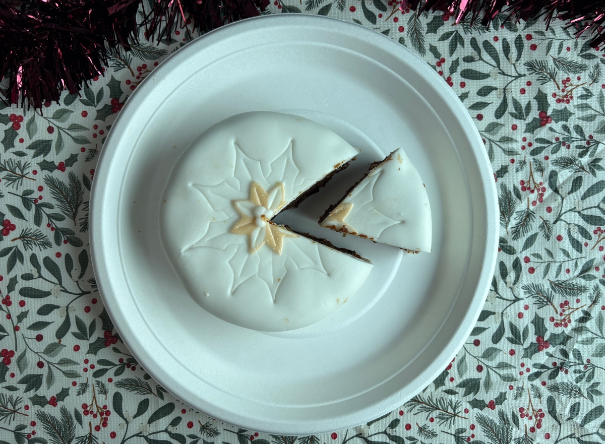 asda christmas cake top-down An image showing the Asda Christmas fruit cake with a slice taken out of it