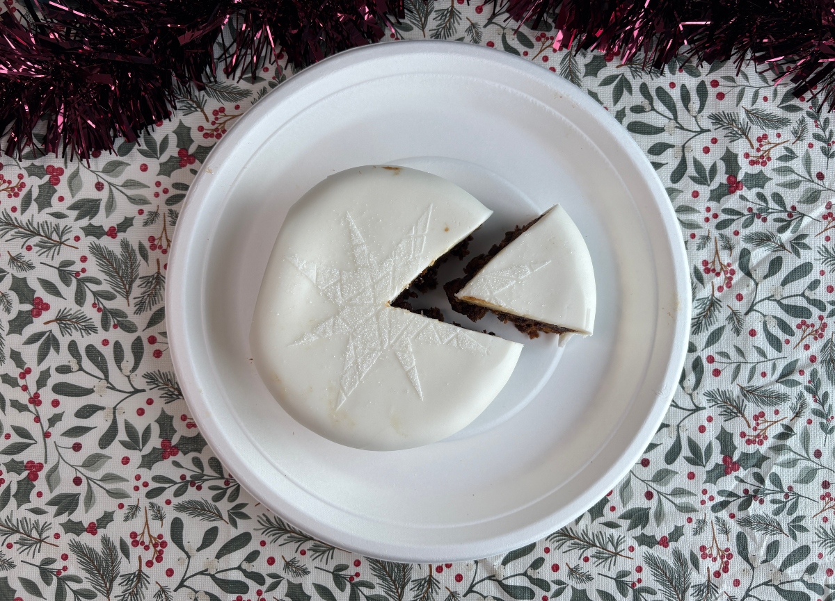 iceland Christmas cake top-down An image showing Iceland's Christmas cake with a wedge taken out of it