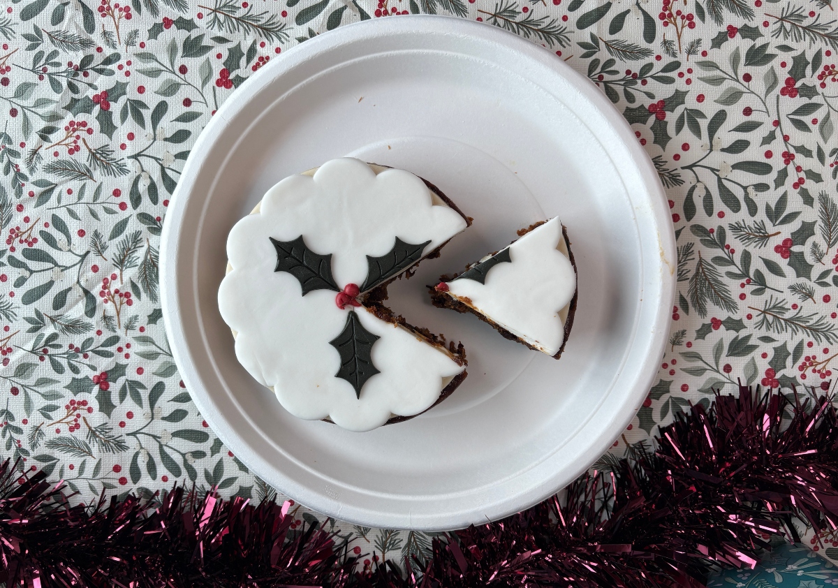m&s top-down christmas cake An image showing the M&S 2026 Christmas cake top-down with a slice removed