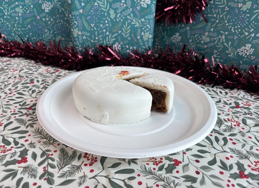 tesco christmas cake 2026 An image showing Tesco's 2026 Christmas fruit cake with a slice taken out